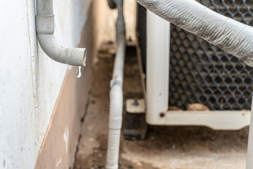 Condensate drain line for central AC unit